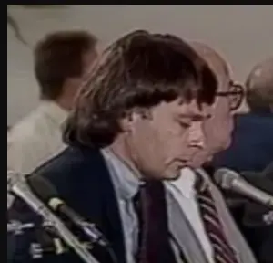 Erik Storm speaking into a microphone